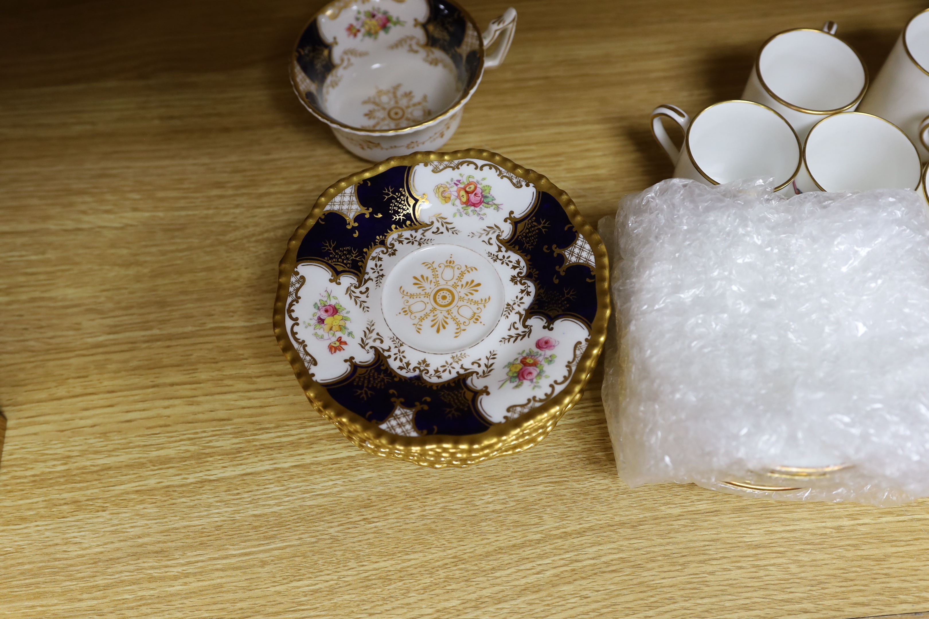 A Worcester bird decorated coffee set for ten and a Coalport tea set